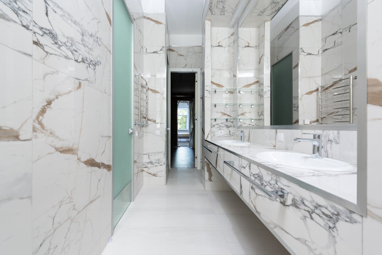 Elegant marble bathroom featuring a modern double vanity design.